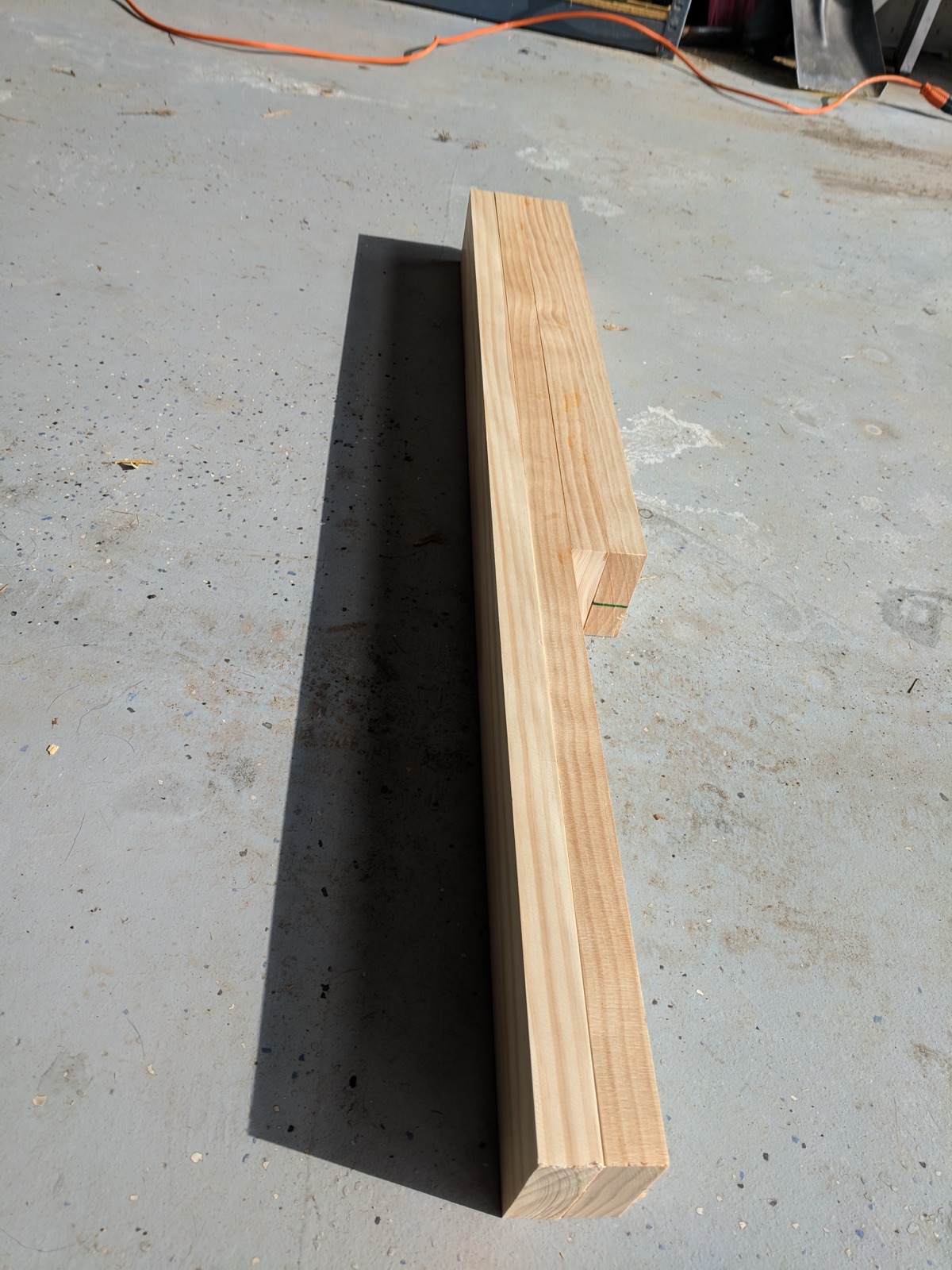 Four lengths of wood cut for the lid frame