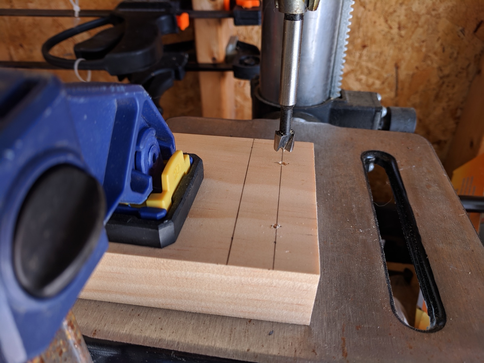 Using the Forstner bit to set the screws in to hide them
