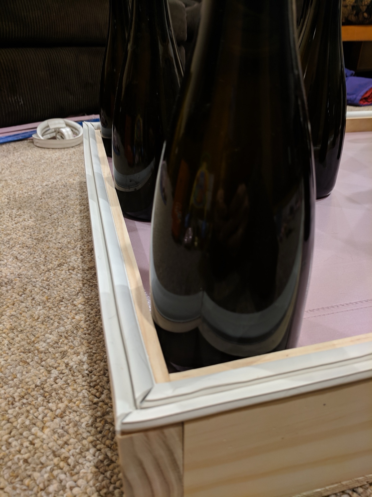 Installing weather stripping to seal the lid.